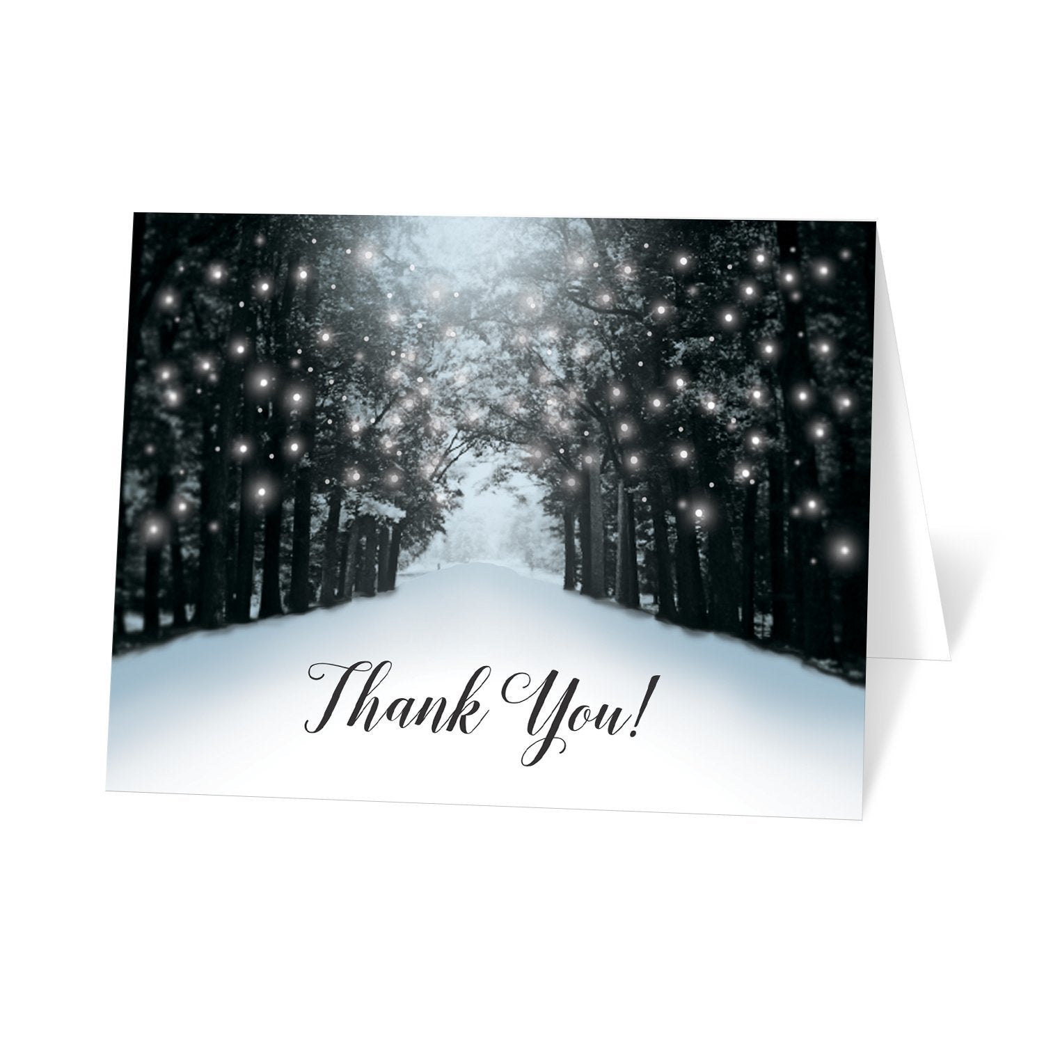 Snowy Winter Road Tree Lights Thank You cards at Artistically Invited. Snowy winter road tree lights thank you cards with a snowy tree lined road filled with white holiday lights. "Thank You!" is printed in a black script font below the design over a snow white background.